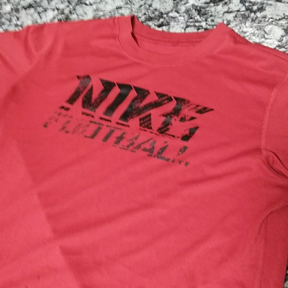 Red Nike football shirt.